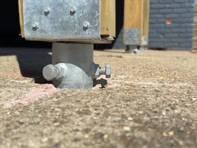 Michigan Ground Screws being installed for a deck foundation